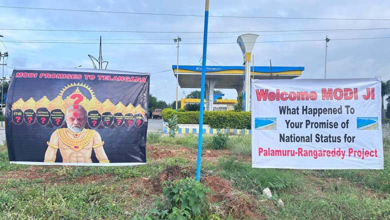 "Posters Criticizing Prime Minister Modi Erected as He Arrives in Hyderabad"